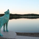 A wolf statue howling at the moon and sea at Ulvön (wolf Island)